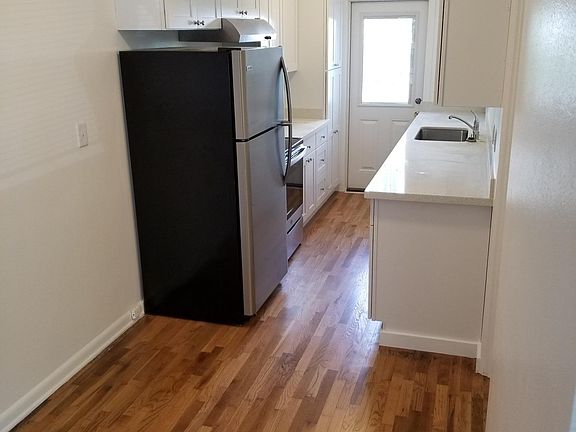 Brand new kitchen with back door to patio