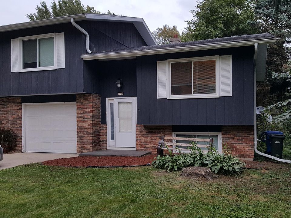 Front elevation on Lyman Lane, family room window on right, bedroom on left, additional on street parking