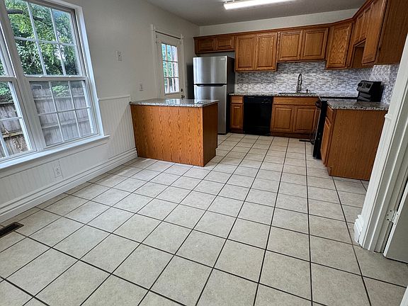 Open eat in area in kitchen. Stainless steel fridge, dishwasher & stove provided. Granite countertops