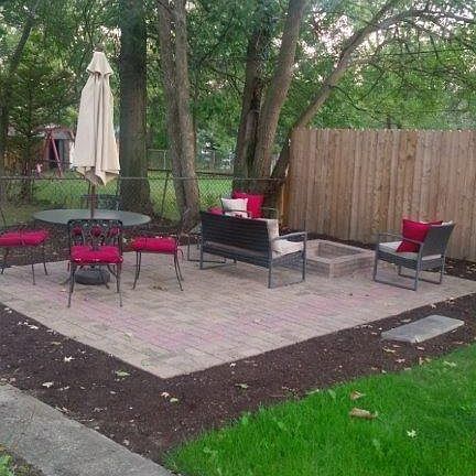 Stone patio near fenced in yard
