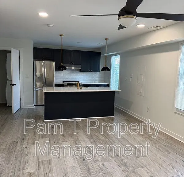 201 W 37th St #CARRIAGE HOUSE — Photo 2