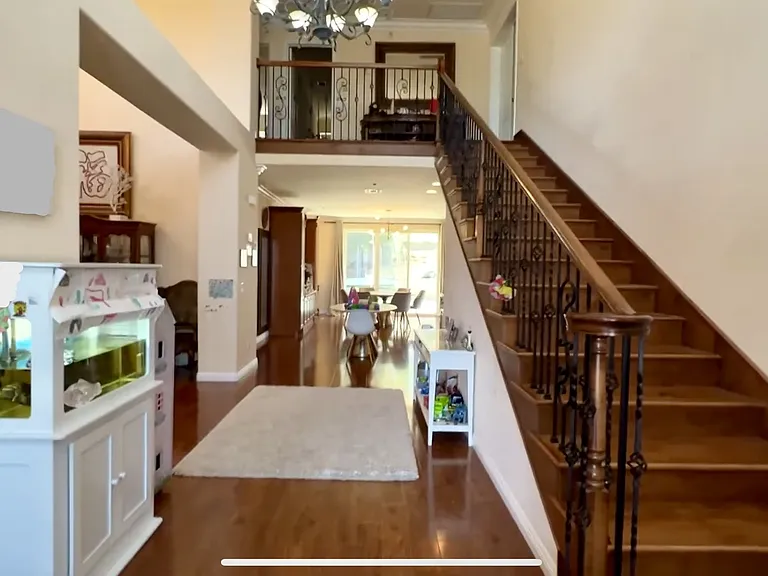 Foyer and staircase leading to upstairs bedrooms