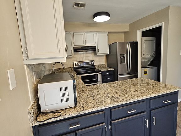 Kitchen and a peek at the pantry / washer dryer.