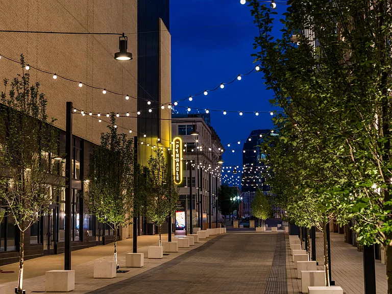 Twinkling lights, tree-lined walkways, and local charm_steps from your front door at the Pinnacle at Nashville Yards. Discover the vibrant heart of the city.