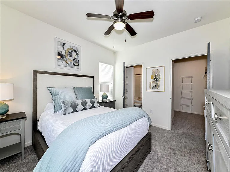 Bedroom with walk-in closet and private bath