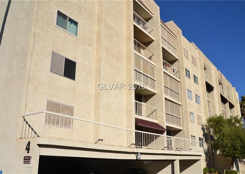 Condo building #4 with its covered and assigned parking for owners.