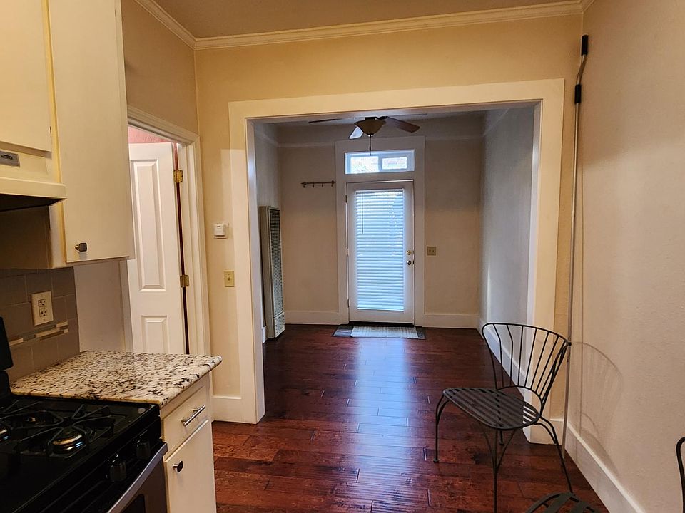 The kitchen has a skylight, gas stove and granite countertops.