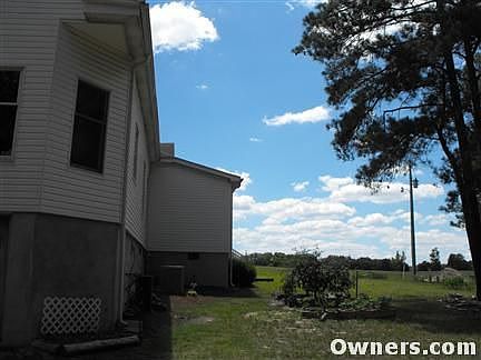 Side of house with more raised beds