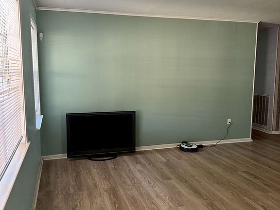 ___ Living Room
"Bright and spacious living area with new wood-look flooring and plenty of natural light. A cozy space to relax, gather, and entertain."