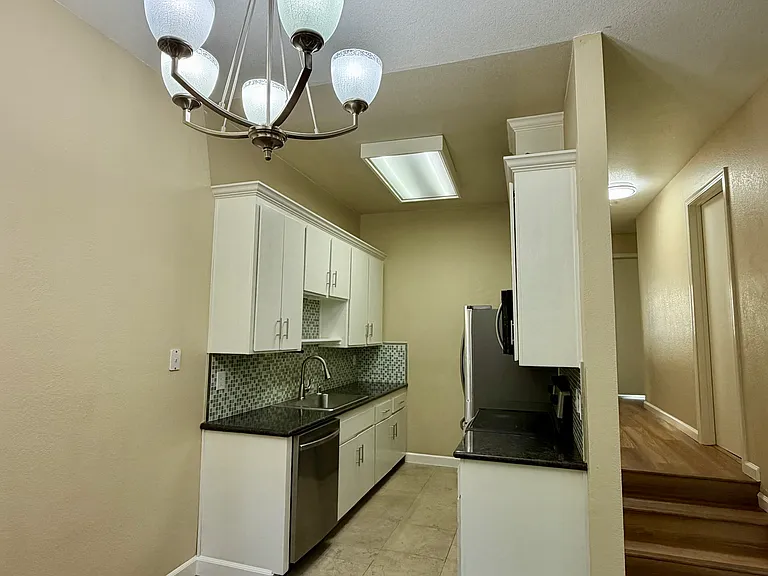 Kitchen, stairs to bedrooms