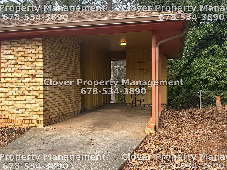One car carport with additional space for 2 additional cars in the driveway or street parking
