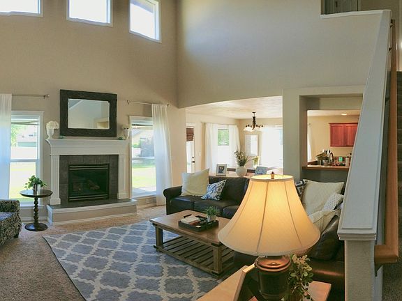 Living room and stairs to 2nd floor (2 rooms, bathroom, bonus room)