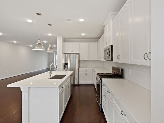 Iced White Quartz and White Cabinetry in the Kitchen