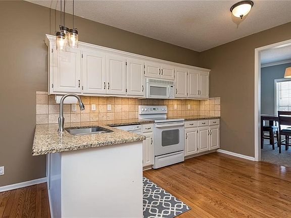 You'll love this Kitchen.  Granite counters, wood floors, plenty of cabinets & counter space.