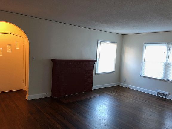 Living room & entry. Note pointed door.