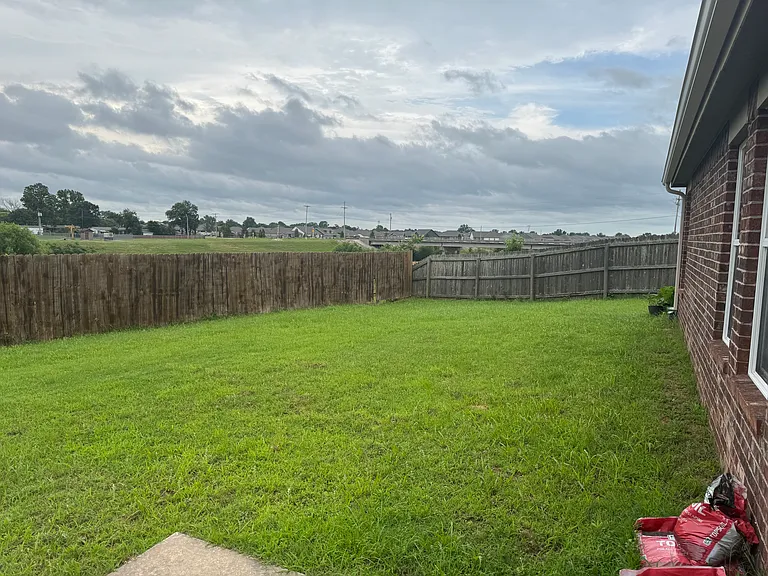 Backyard..bike trail behind fence