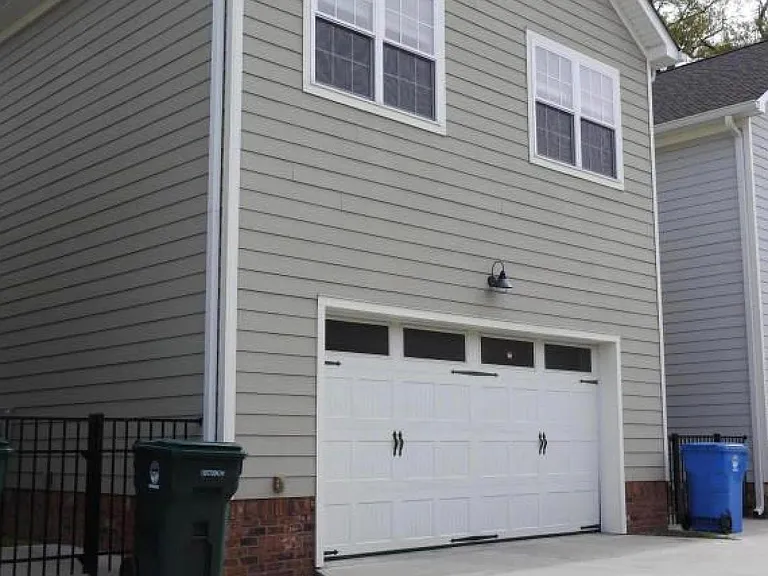 Attached double garage accessible from private alley