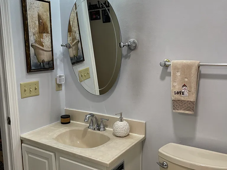 Full bath with standard fiberglass shower/tub unit to the right