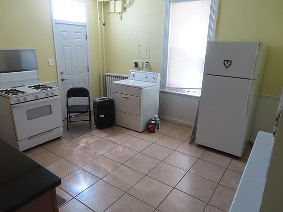 Large Kitchen with dryer and refrigerator