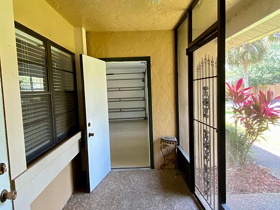 Enclosed front porch between front door and oversized 2 car garage with epoxy floor!