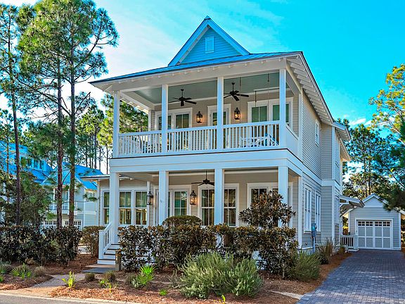 View of House with Garage