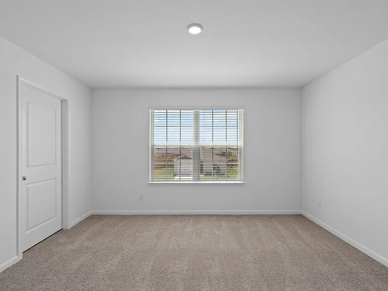 Game room with a window overlooking the front yard.