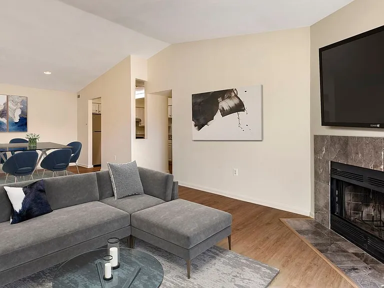 Renovated Woods I living and dining area with hard surface flooring