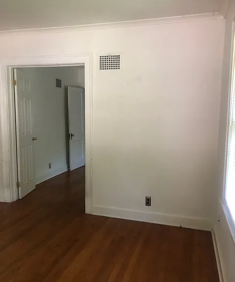 First bedroom looking into the hall between the two downstairs bedrooms