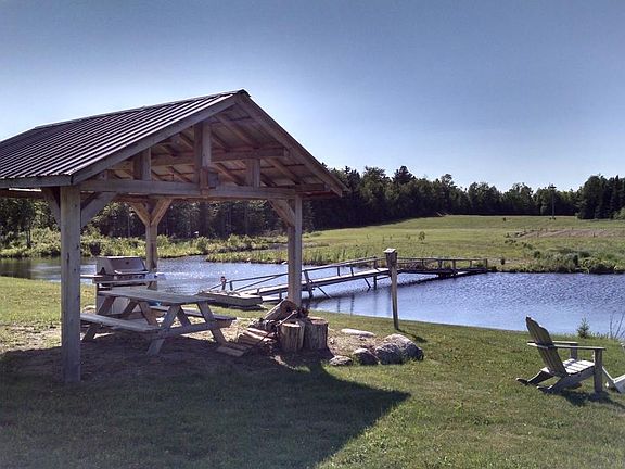 Gazebo by the pond with grill.