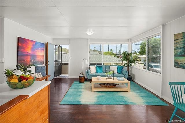 Bright and airy open living and dining areas. (Staged with furniture)