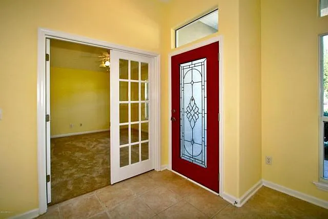 Facing front door and office/den