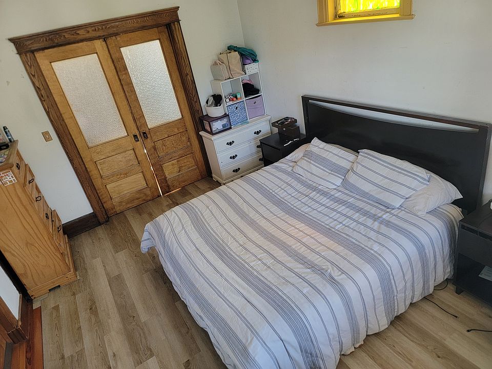 Main bedroom with walk-in closet. Fits California king size bed. Double pocket door entrance. Access to front covered porch.