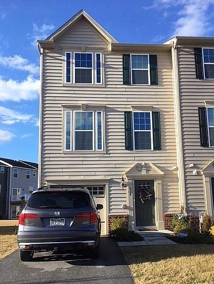 Front of house - end unit with parking in the driveway