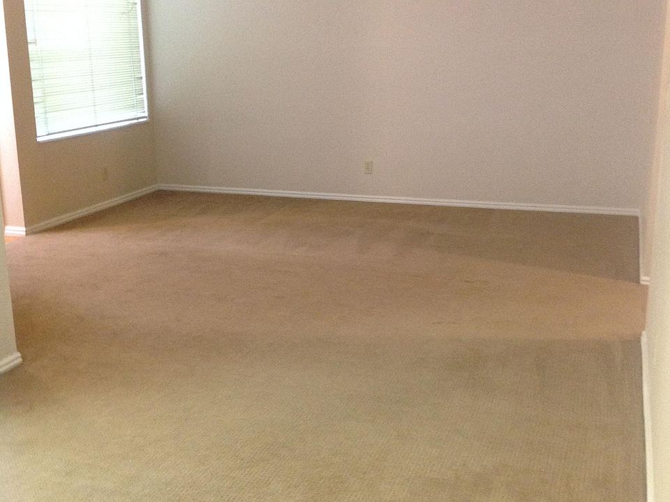 Living room with ceiling fan.
