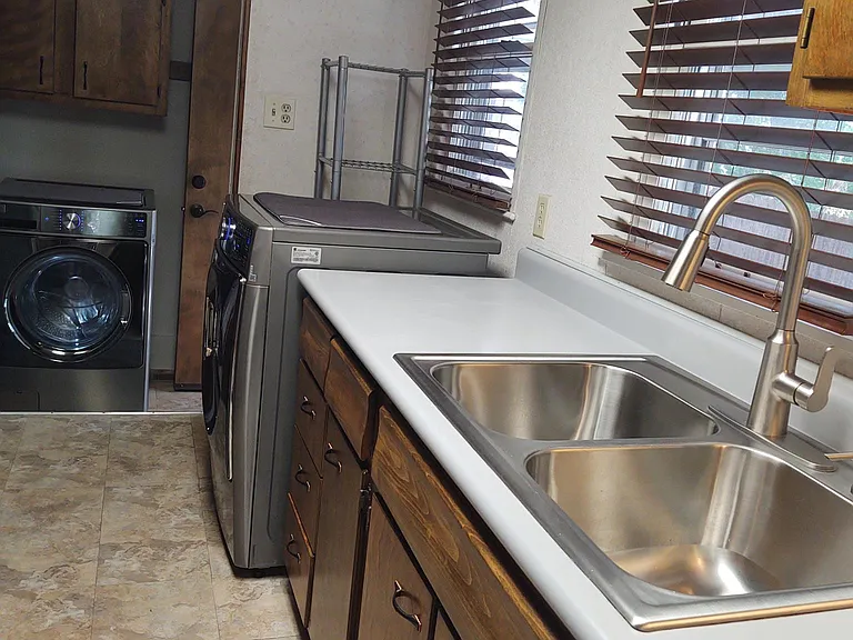 kitchen w/newer washer/dryer and stainless steel sink/faucet, dishwasher