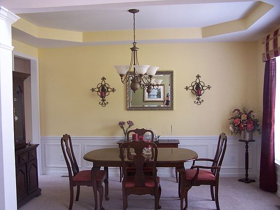 Elegant Dining Room w/ chair rail and trey ceiling