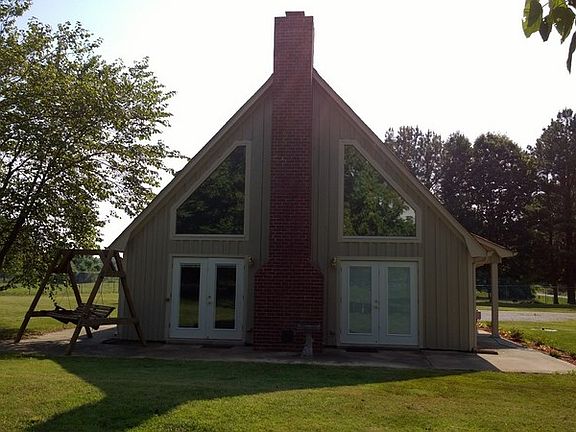 Fireplace and french doors : Fireplace and French doors, large triangle windows