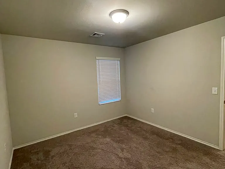 Second bedroom to the right from the entrance. Includes a spacious closet.