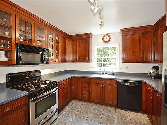 Custom cabinetry with abundance of storage/counterspace. There are two ovens (one is in the adjacent laundry/pantry area).