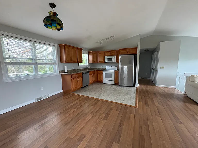 Kitchen view with hallway towards 2 bedrooms and one bathroom