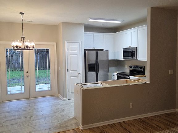 Brand new kitchen cabinets with marble inspired counters to come!