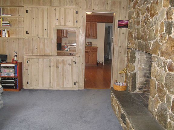 Family Room with Floor to Ceiling Stone Fireplace