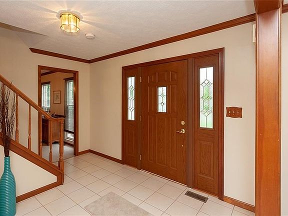 The large and open foyer greets you as you enter the home.