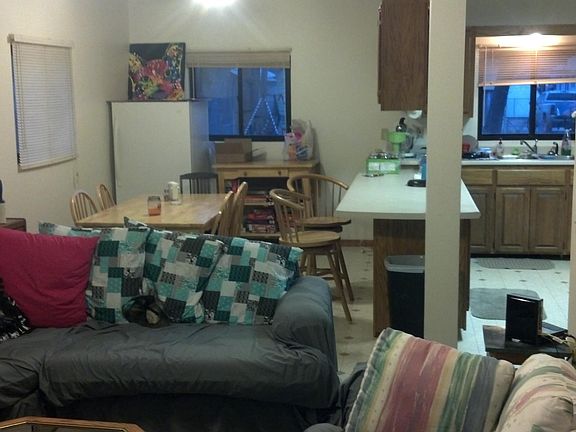Large dining room opens to living room with large island.