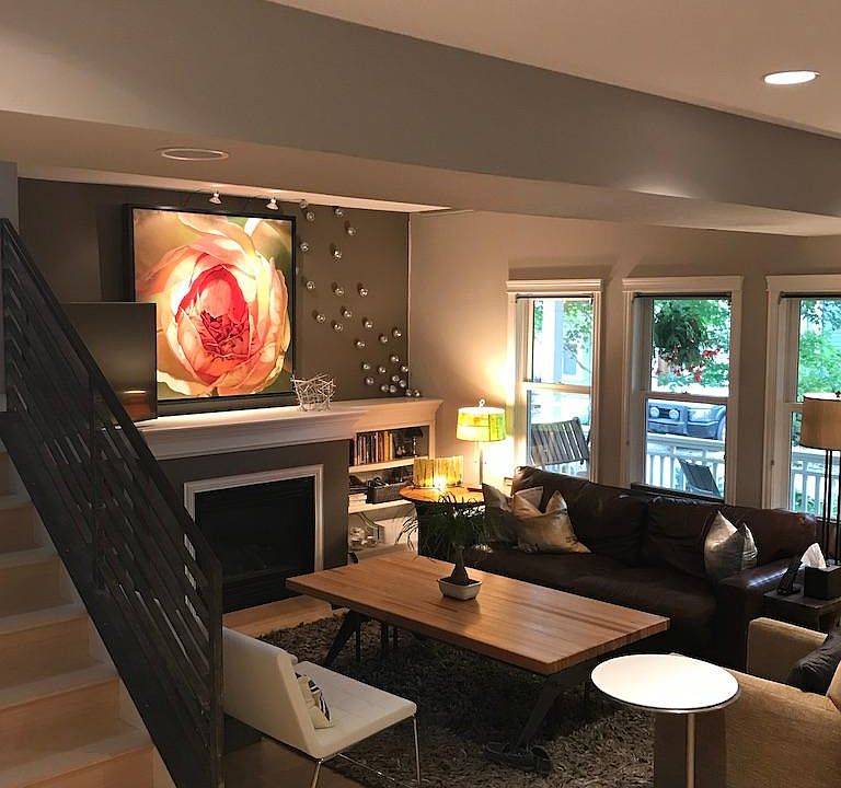 great room with custom built 6 person adjustable height table to accommodate dinner in front of the fire or tv