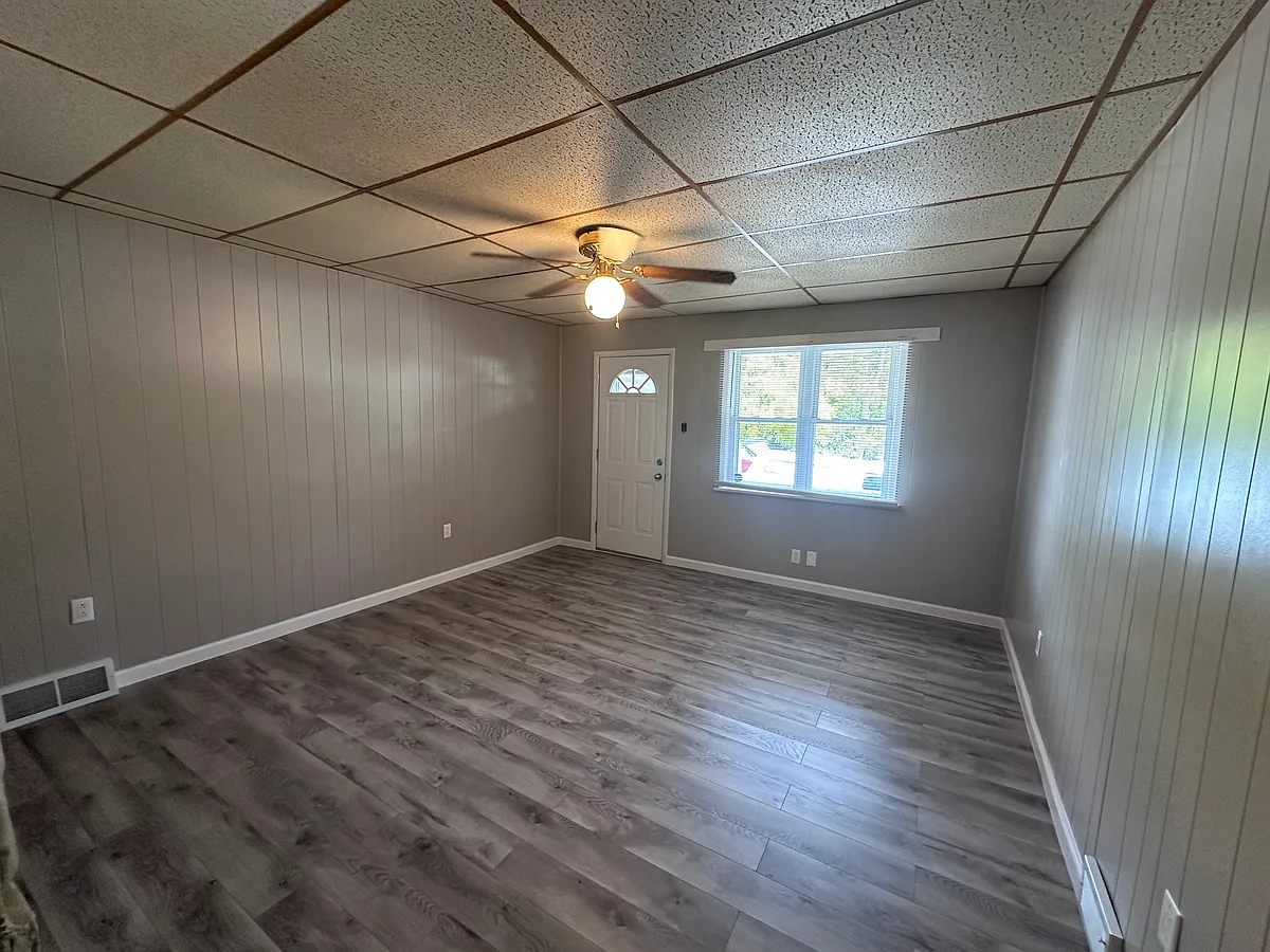 Living Room with new flooring, paint, outlets and ceiling fan. - 430 2nd St