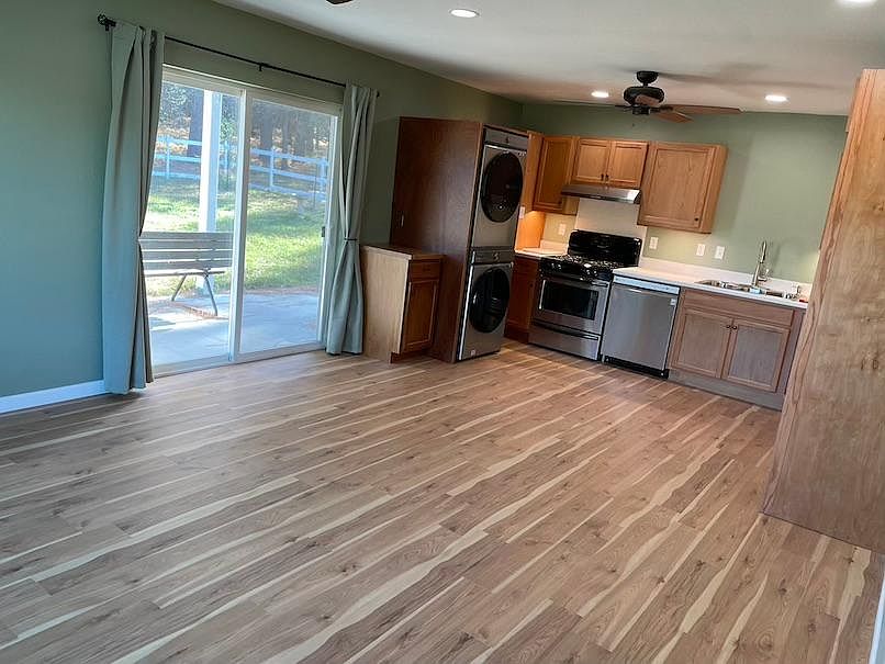 Kitchen with new LG washer/dryer, new countertops and dishwasher.