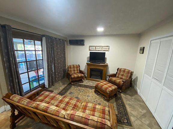 Bifold doors in living room to close off bedroom