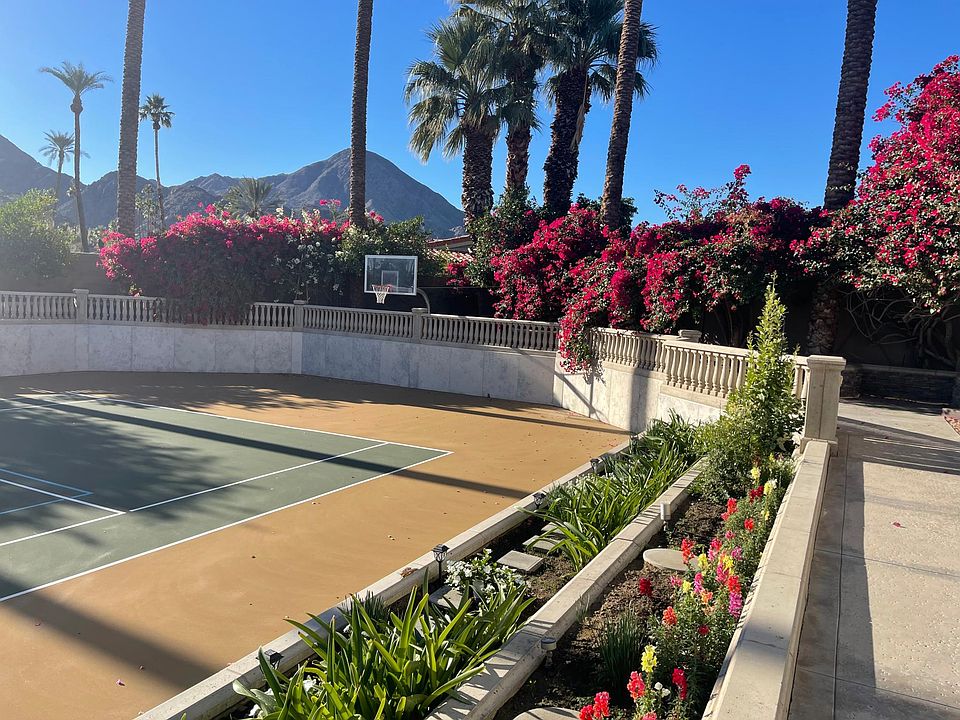 Basketball and cascading Bougainvillea at south end of Tennis Court