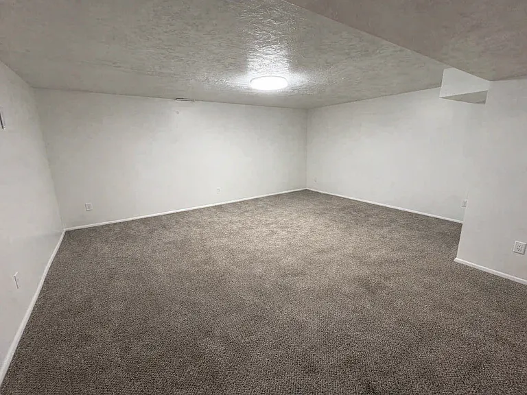 Yes! Your big sectional sofa will fit in this huge living room.